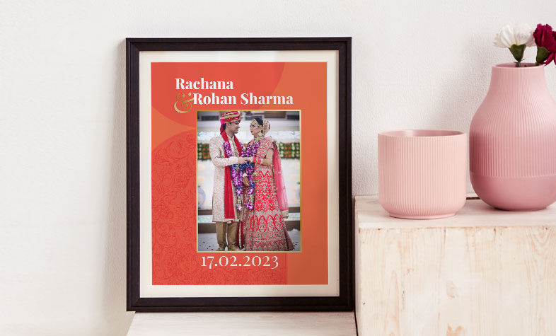 Creative photo frame arrangement on a home wall