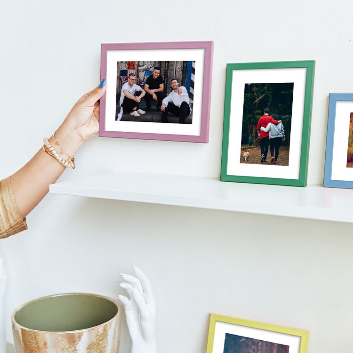 Coloured photo frames displaying pictures of friends and loved ones